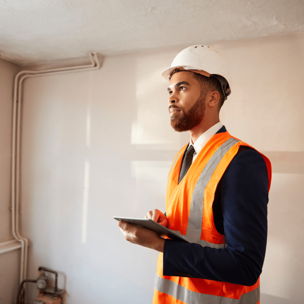 surveyor checking house